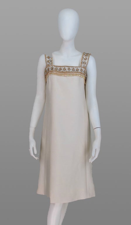 I love the simplicity of this A line cocktail dress from the 1960s...Classic with a modern twist something Mia Farrow might have worn...Malcolm Starr from the 1960s...Heavily beaded yoke, ivory textured silk blend, fully lined, closes at side back