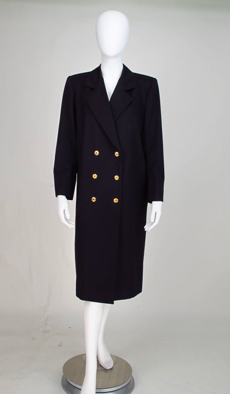 Classic chic, Yves St Laurent Rive Gauche, double breasted black wool gabardine coat...Fully lined, double row of gold buttons at front, with matching buttons at cuffs...On seam side pockets...Marked size 40...All our clothing is dry cleaned and