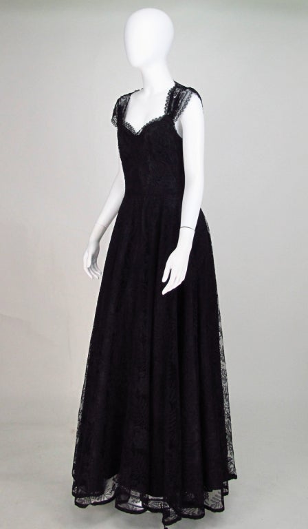Last seen dancing into the night in the arms of Cary Grant, Gregory Peck or my choice Jimmy Stewart...This bewitchingly sexy black lace gown...made for dancing, with it's wide sweep of hem and it's daringly reveling back, all eyes will be on you