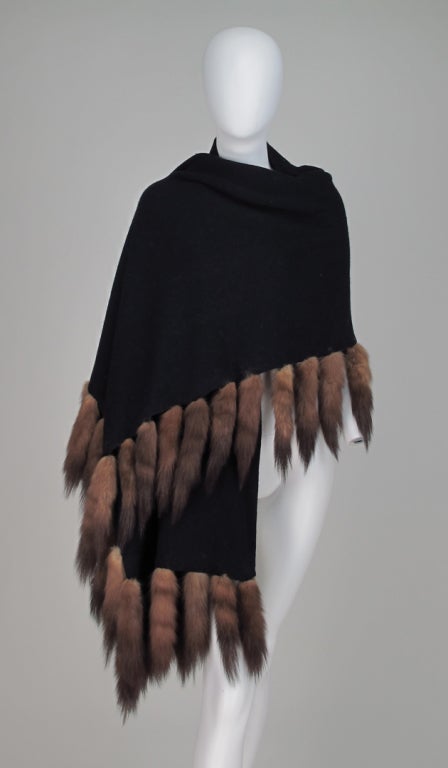 Luxurious black cashmere knit stole trimmed on 3 sides with sable tails...from Adrienne Landau...

All our clothing is dry cleaned and inspected for condition and is ready to wear...Any condition issues will be noted...

Measurements are: 
23
