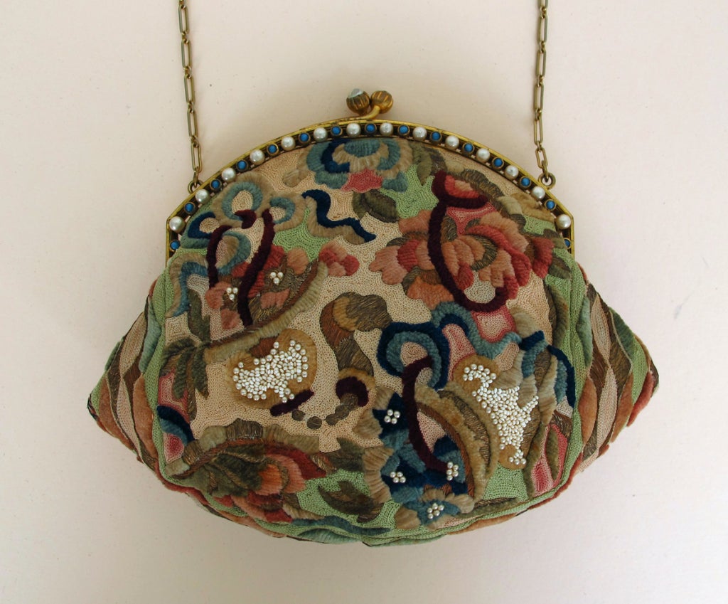 1920s jewel frame evening bag...gold frame is set with pearls and turquoise stones with a chain handle...the bag is heavily embroidered 18th C fabric with chenille thread, seed beads, gold thread and silk floss, beautifully detailed work in