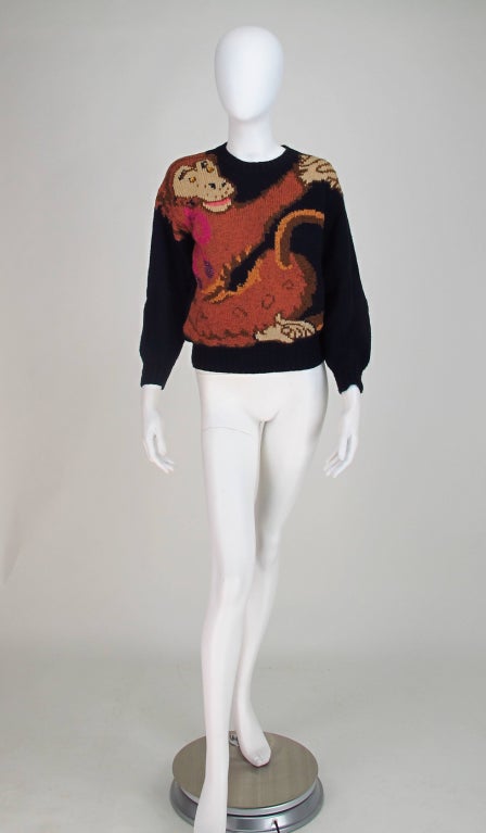 Monkey love...From Krizia Maglia 1980s, designer Mariuccia Mandelli was famous for her yearly animal sweaters during the 1980s and here is one of the hardest to find, Monkey Love...A  sweater with a happy monkey to hug your shoulders...Black wool,
