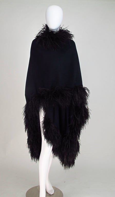 Dramatic evening glamour, arrive and unwrap in style...Oscar de la Renta, fine lightweight wool jersey & marabou evening wrap/cape in black...Cut like a cape and trimmed on all edges in marabou, one size will fit most...All our clothing is dry