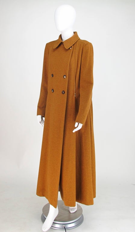 A coat for roaming the moors, keeping warm in your castle or being uniquely you...Hermes military influenced maxi coat from the 1990s...Double faced wool in a mustard/tobacco colour...Double breasted, bodice has zippers at size fronts and backs that