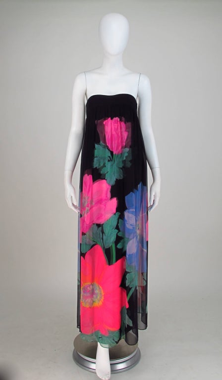 A vibrant silk gown from Hanae Mori dated 1968...The fitted under dress is in printed silk,with an attached interior boned corset, a long back vent...The over dress is in coordinating silk chiffon...Closes at the back with zipper at corset and