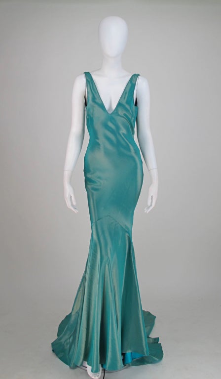 Tiffany blue touched with gold, the fabric is gorgeous...Galliano, with a bit of 30s influence, comes up with a red carpet worthy gown...Way beyond glamorous...Pull on stye bias cut gown with a draped cowl back and train...Deep V front, it's