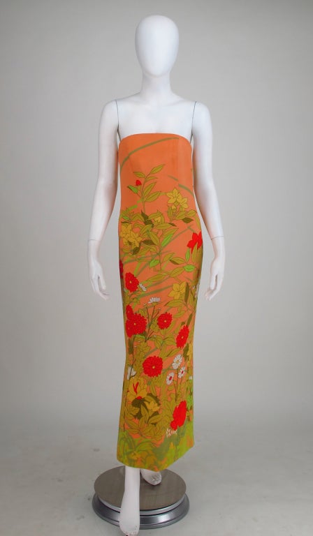 Peach silk strapless gown printed with a bright flower garden from Hanae Mori and dated 4/17/68...Couture quality with hand set zipper, hand finished lining, weighted hem...Interior boned corset...Peach silk with fantasy flowers...Dress is fitted