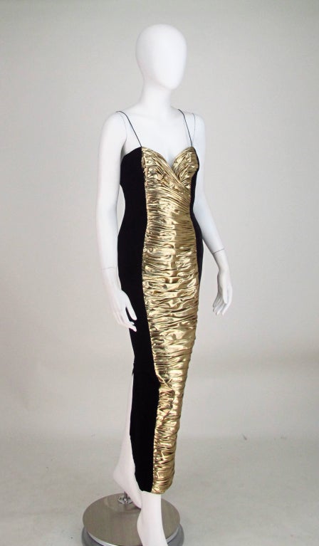 Fabulous gold lame drape front gown from the 1980s by Vicky Tiel...Fitted gown in black velvet with pleat draped front panel, deep back hem vent...Dress is fully lined with boned bodice,  closes at the back with a zipper & hook/eye...Marked size