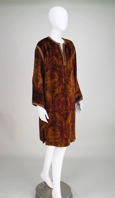 Renascence inspired printed silk, tunic dress in rich shades of garnet & amber...Long sleeve, cord button front tunic trimmed with soutache braid in amber, open side vents...Fully lined...Marked size 10...In excellent wearable condition...

All