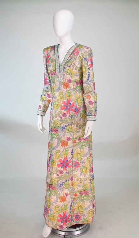 Unique to find, silk metallic floral gown from Alvarado Bessi...Bessi founded his namesake company in 1950 and is best known for his silk jersey floral prints...This gorgeous gown is a soft silk lame brocade, with a silver & gold ground and muted