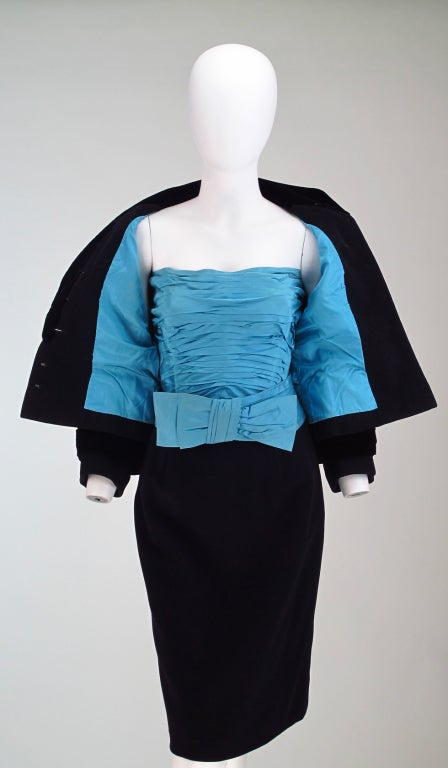 A black wool(feels like cashmere or cashmere blend) & velvet dinner,theater suit from Maggy Rouff, with original ruched boned bustier and belt in turquoise silk, which matches the jacket lining...This suit is expertly handmade and hand