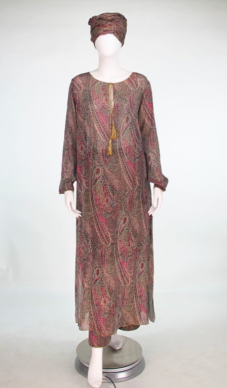 Oscar de la Renta bohemian inspired evening set in metallic gold shot silk chiffon with a woven paisley design...Long sleeve full length caftan with gold tassel cords, gold cord trims at neckline, cuffs & hem and side vents, unlined...Pull on wide