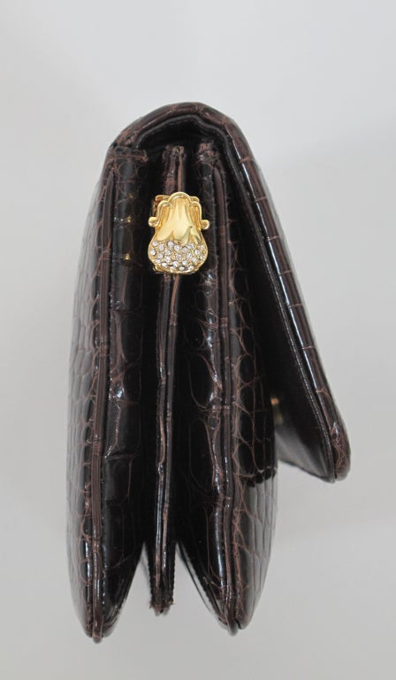 Judith Leiber chocolate brown glazed alligator handbag or clutch, with 2 changeable handles, one gold chain and one gold handle set with crystals, these are added via crystal and gold side pieces...Bag has the original mirror & comb, change purse