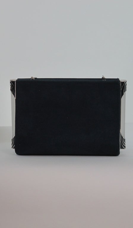 Judith Leiber navy blue suede handbag, can be carried as a clutch or shoulder bag...Unique frosted Lucite bars at each side pull to open, trimmed with blue and silver enamel...silver chain handle...In excellent barely used condition, with original