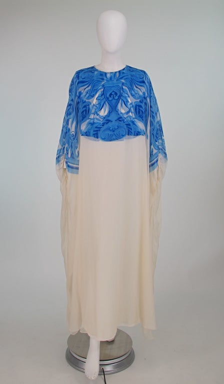 Gorgeous blue and white silk chiffon caftan from the 1970s from Adelaide of Capri...Long sleeveless under dress is slightly fitted, the bodice is printed in the abstract blue design, it closes at the back with a zipper and hook/eye at neckline...The