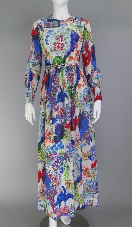 Bold graphic print...bohemian style maxi dress from the 1960s...fitted bodice with pinch pleating at waist and hip...long slightly full sleeves with deep pinch pleated cuffs...softly gathered skirt...with thick self fabric belt...lightweight fluid