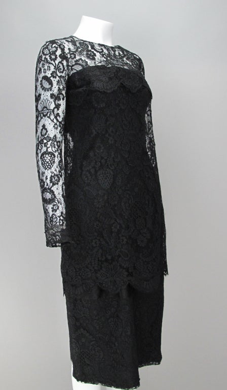 “It is my intention to try and adapt haute couture to modern requirements: to make dresses that are simple and chic.” Guy Laroche…A fabulous dress in fine Guipure lace...from the 1960s...
Black lace tiered strapless cocktail dress…black satin band