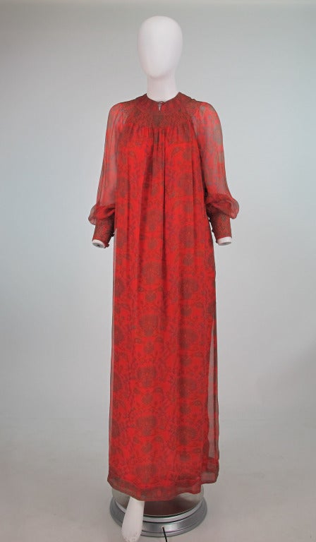 Treacy Lowe, London...1970s hippie chic in silk chiffon, paisley print design with smocked neckline and cuffs,a single decorative button and loop at the front neckline, cuffs have button and loop closure, dress is fully lined in silk & closes at the