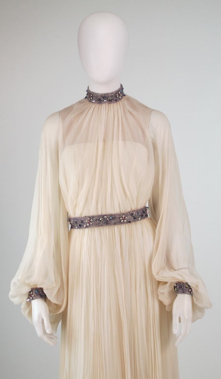 Labeled, Jose' de Lema at the New York Hilton, a specialty boutique within the hotel, Lucille Ball had an apartment at the Hilton in the 1960s...Couture quality with much handwork, Ivory silk chiffon gown with long very full sheer sleeves, fitted