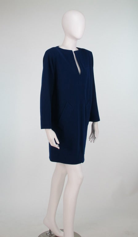 YSL Rive Gauche blue wool knit tunic dress...Classic style from the 1980s, but with a modern contemporary feel...Marine blue wool knit tunic dress...Pull on style dress has long sleeves, welt seams, center neck and hem front vents and front vertical