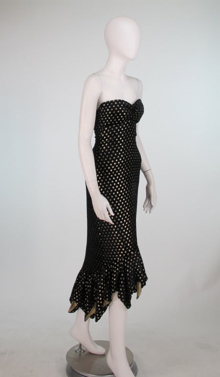 Liquid black panne velvet with gold lurex dot fish tail cocktail dress from Ellene Warren, 1980s...Strapless, boned dress is fitted from bust to above the tiered tail hem, hem is lined in gold lurex fabric...Ellene Warren was know for her 