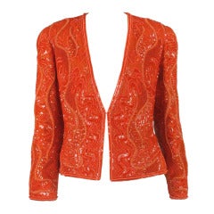 Chaqueta de noche de lentejuelas y cuentas en color caqui y rosa picante de Bill Blass