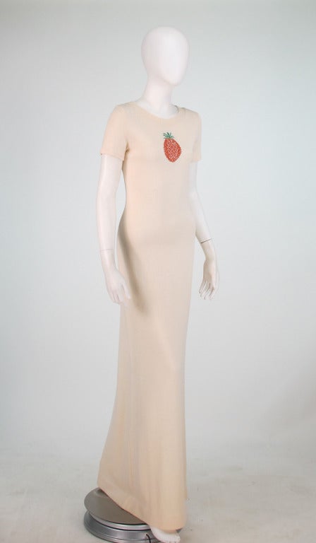 Cream knit hostess dress from the early 1970s...Hard to find Diffusion label by Adolfo exclusively for Saks Fifth Avenue...Sleek maxi dress is pull on style with ribbed neckline, short sleeves and super long length...Knitted at the front is a golden