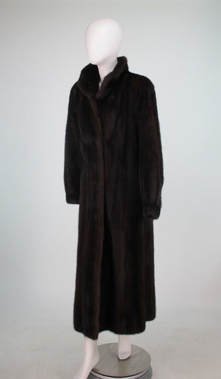 Gorgeous dark full length mink coat...Banded cuff to keep out the cold...Fully lined...closes at the front with fur hooks...In excellent condition, fresh from storage...Stay warm in style this winter!...Fits like a modern 4-6...For visual comparison