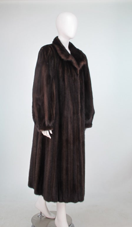 Givenchy Haute Fourrure full length mink coat in rich mahogany...Wear the collar up or down...The coat closes at the front with fur hooks...There are on seam front pockets...The sleeves are gathered into cuffs to keep the cold out...In excellent