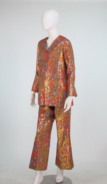 Bill Blass Mid Century Modern metallic brocade pant set...Pull on style long tunic top has long shaped cuff sleeves, banded front pockets, placket front band with gold rhinestone buttons, top closes at the back with a zipper & hook/eye, fully lined,