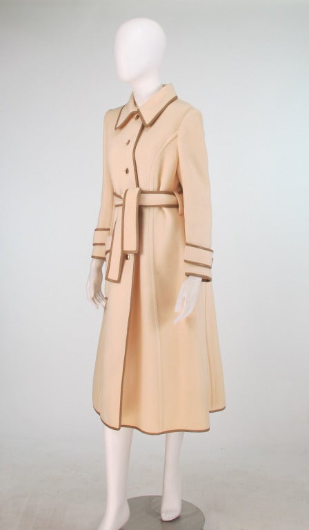 Winter white double face wool trench style coat, a soft mid weight wool that feels like it is part cashmere...Princess seamed, fitted coat with long sleeves, single button front closure, waist wrap belt, single hip front flap pocket...All facings