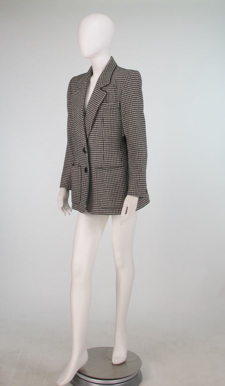 Yves St Laurent cashmere blazer in black and white hounds tooth check...Two button front closure...Two hip front patch pockets, besom chest pocket...Jacket is slightly fitted with front and back waist darts...3 Button cuffs...Fully lined in