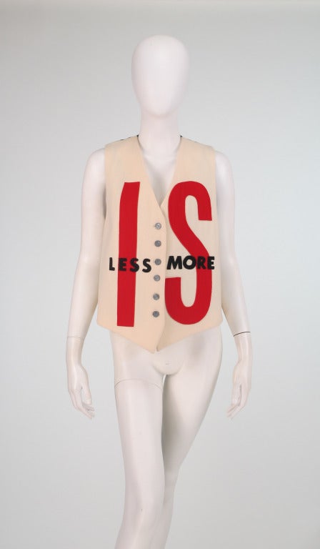 Is less more?  Or, is More less?  I don't pretend to know...I do know I love Moschino's statement making pieces!  Read it as you see it...Moschino wool applique vest in ivory, red and black, with black & white striped fabric back...Adjustable at the