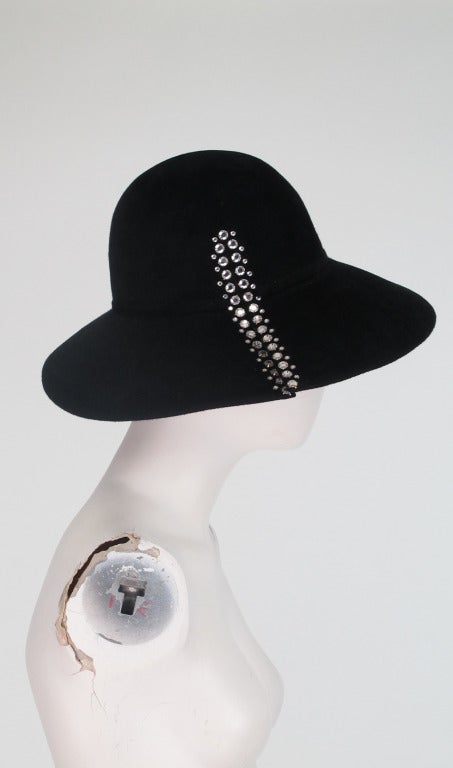 I can't imagine buying this hat & never wearing it!  Black wool velour fabric is gorgeous with a subtle sheen...With the original tag...Unworn and in pristine condition...This hat has a high crown and a wide brim that is slashed at the side where it