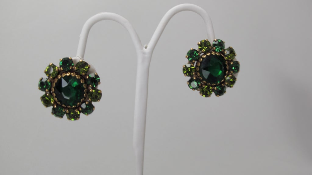 Brilliantly sparkling emerald green rhinestone clip back earrings...set in gold...from the 1950s by Weiss.