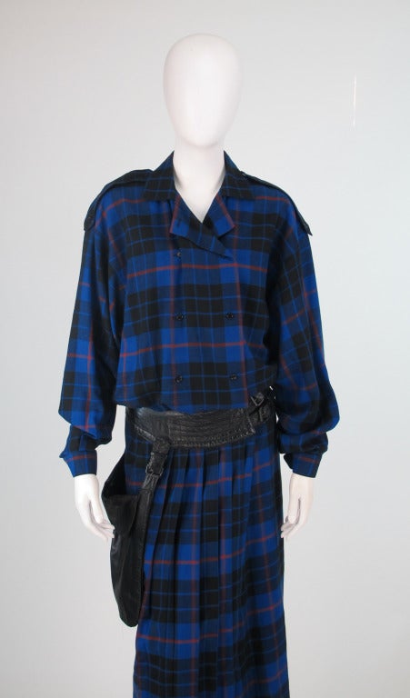 Canadian designer Wayne Clark apprenticed at Hardy Amies in London, returning to Canada in 1977 he designed for Aline Marelle until he opened his own company in 1989...From the 1980s a punk inspired dress in blue & black plaid with black leather