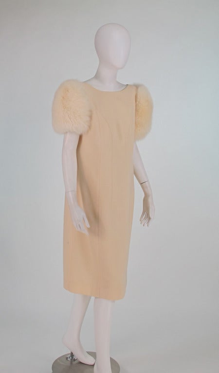 1980s Victor Costa winter white wool dress with white fox sleeves...Creamy white light weight wool dress has princess seaming, bateau neckline at the front and a low scoop back...The dress closes at the side back seam with a zipper and hook/eye, it