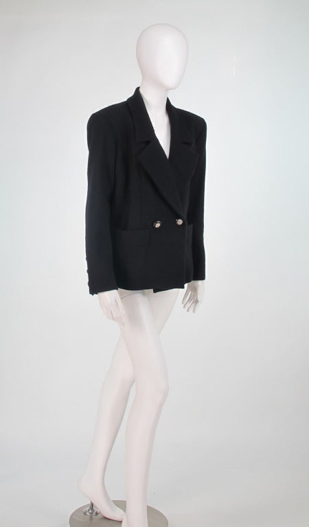 1990s Yves St Laurent YSL black wool double breasted jacket...Classic style & perfect with jeans or dressier trousers...Mid weight hearing bone woven wool...double breasted style closes at the waist with two large black buttons with gold filigree