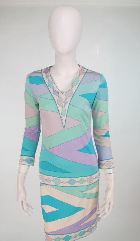 1960s Emilio Pucci aqua geometric silk day dress...V neckline, 3/4 length sleeves, side bust darts...A line shape dress with bold geometric print is bright sea colours...Marked size 12 (vintage), fits like a modern US 4...

In excellent wearable