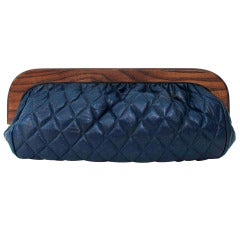 1980s large wood frame navy blue quilted leather clutch bag