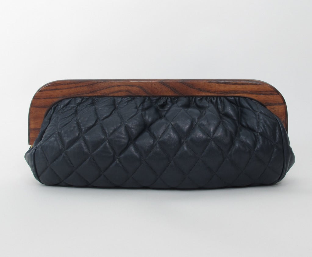 1980s large wood frame navy blue quilted leather clutch bag In New Condition In West Palm Beach, FL