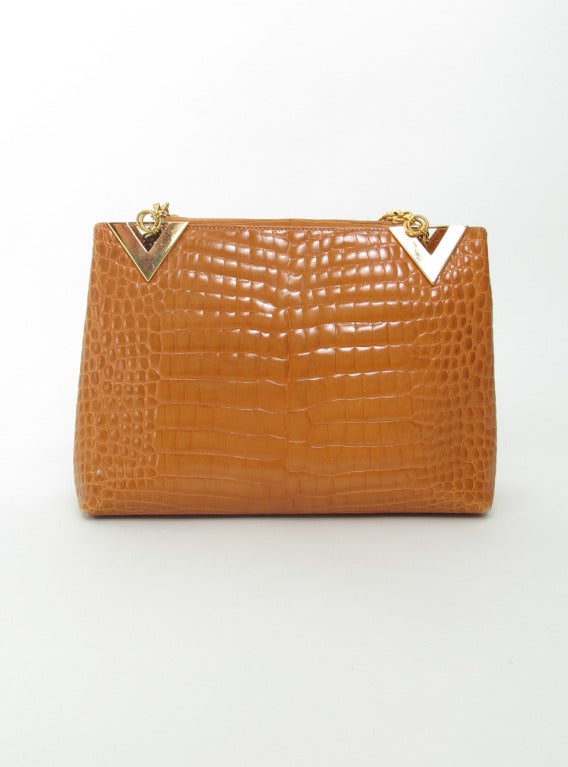 Valentino Couture butterscotch alligator handbag with double gold chain straps...Open center compartment, with single side pocket inside...lined in cheetah print fabric...Bag closes with a wide tab of alligator that slips into an inside band...