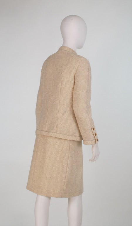 Women's 1980s Chanel ivory boucle suit with gold lurex thread