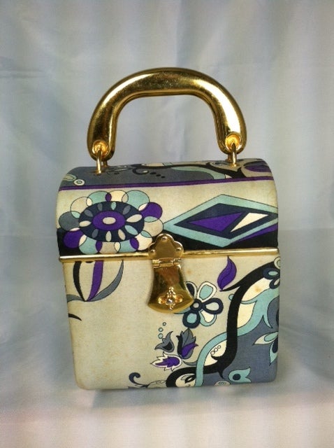 Vintage Pucci little box bag in light blue, lavendar and grey silk signature fabric.  Full leather lined with inside sleeve pocket.<br />
Please note that all sales are final. No returns or exchanges. Please call us with any questions or for