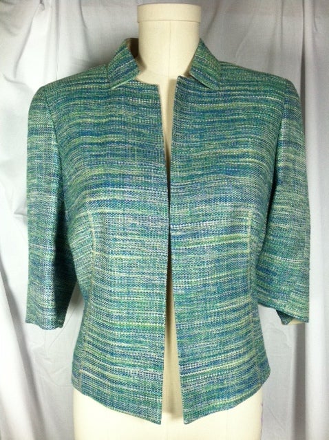 Aqua silk tweed 3/4 sleeve jacket.  Beautifully tailored, partially lined with finished edges.<br />
<br />
Please note that all sales are final. No returns or exchanges. Please call us with any questions or for additional photos and information