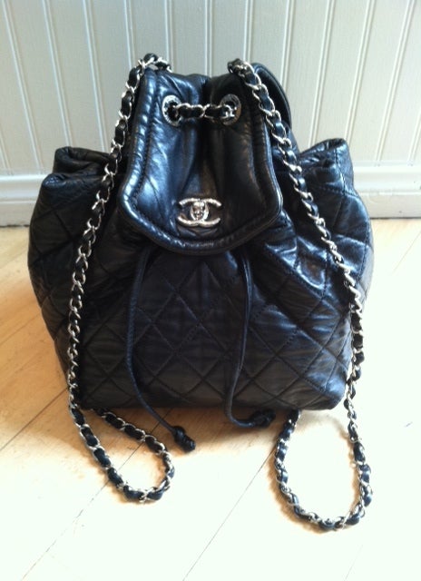 Black Chanel quilted lambskin backpack with silver hardware. 2 in 1 bag.
