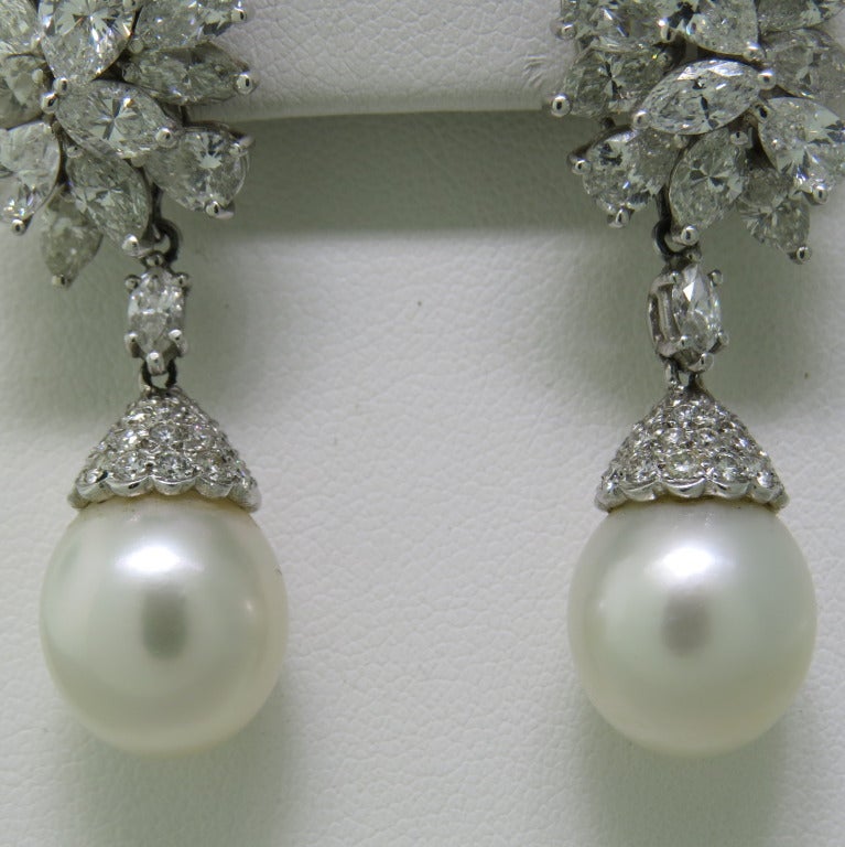 pear and marquise diamonds set in platinum with removable diamond and south sea white pearl drops . approx total diamond weight . 9.50 -10.00ctw, pearls approx. 12.5mm x 12.8mm. 53mm long , 15mm wide.  tops are 28mm X 15mm