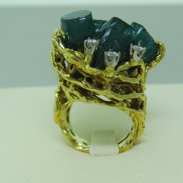 18k yellow gold free form cocktail ring set with Chatham Man Made emerald crystal enhanced with 6 round white diamonds weighing approximately .60cts. top of the ring 28mm x 22mm,  sitting 3/4