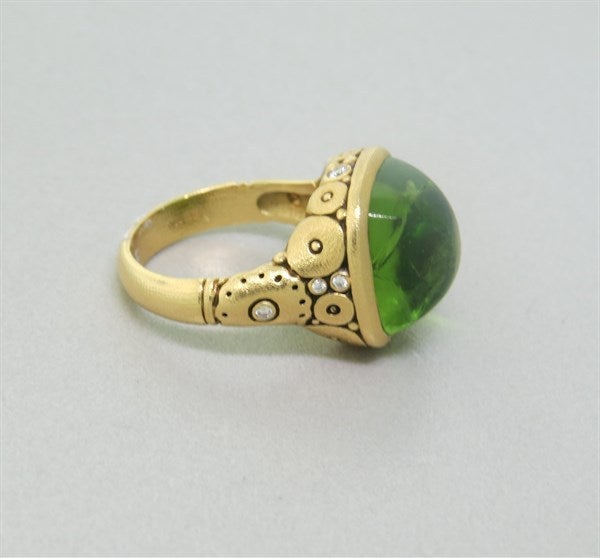 ring aus 18k Gelbgold. 
Diamanten - ca. 0::12ctw G/VS
Peridot 
Maße: Ringgröße 4 3/4:: Ring oben ist 14mm x 14::5mm Gezeichnet: Alex Sepkus:: 750 
 Gewicht: 8::4g