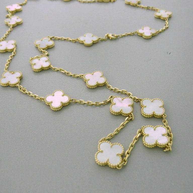 Van Cleef Arpels 18k gold Alhambra 20 clover necklace with mother of pearl, retails for $14800. Necklace is 31